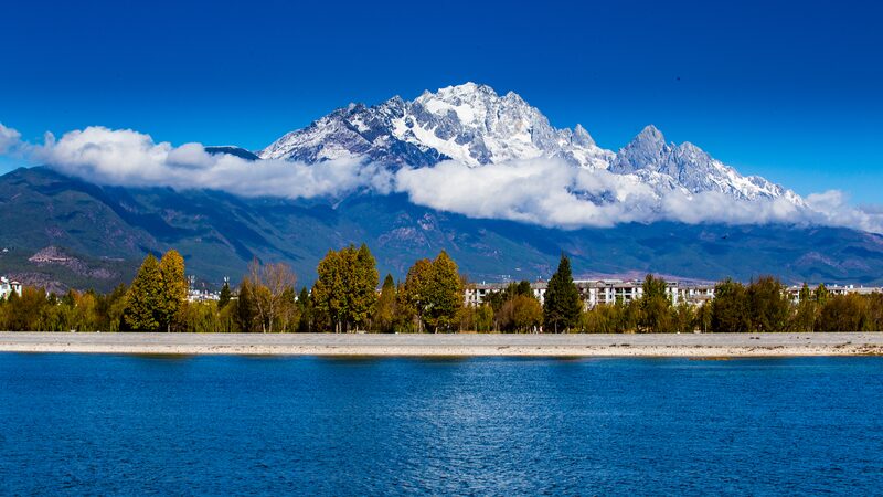 Breathtaking Views of Yulong Snow Mountain Through Spruce Forest Breathtaking_Views_of_Yulong_Snow_Mountain_Through_Spruce_Forest video poster