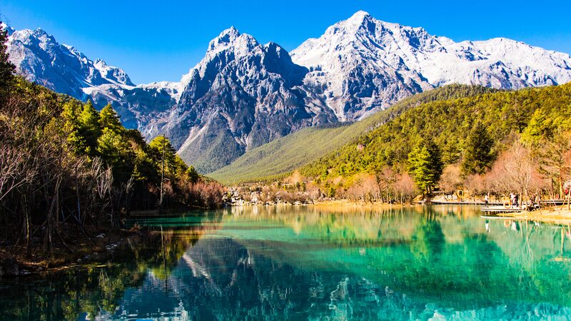 Breathtaking Views of Yulong Snow Mountain Through a Spruce Forest Breathtaking_Views_of_Yulong_Snow_Mountain_Through_a_Spruce_Forest video poster