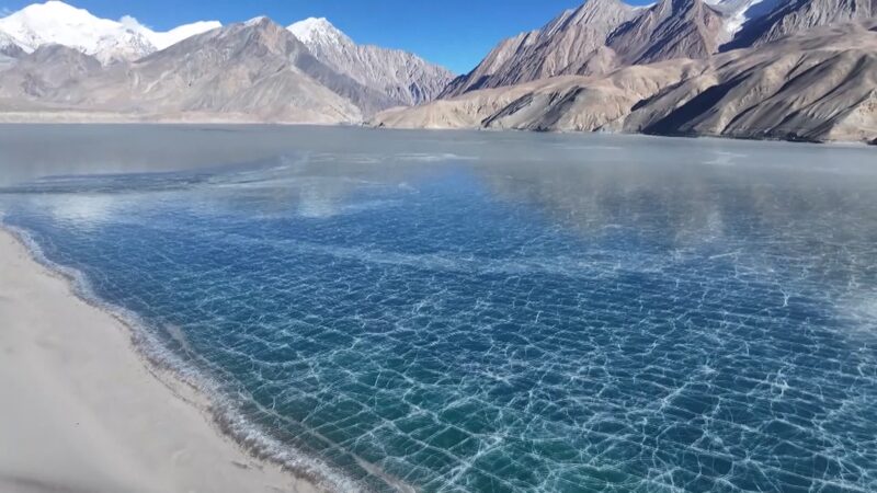 Frozen_Marvel__Ice_and_Sand_Unite_at_Xinjiang_s_Baisha_Lake_poster - My Global News: Voices of a New Era Frozen_Marvel__Ice_and_Sand_Unite_at_Xinjiang_s_Baisha_Lake video poster