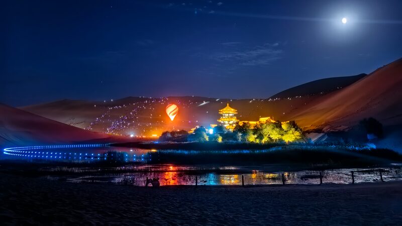Moonlit_Magic__Celebrating_Mid_Autumn_Festival_at_Mingsha_Mountain video poster