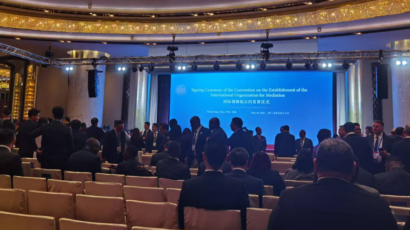 Wang_Yi_Advances_Global_Mediation_at_Hong_Kong_Signing