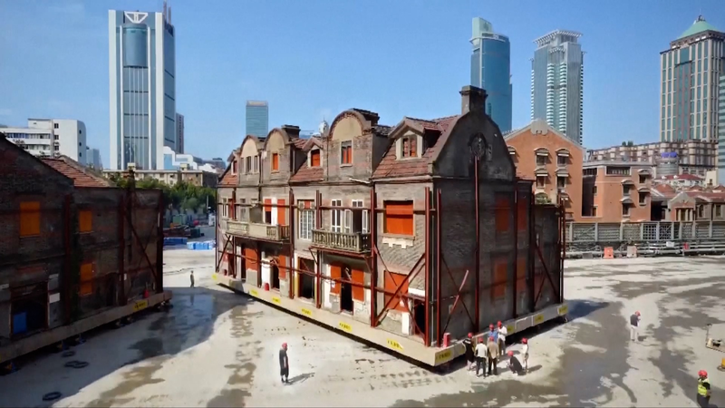 432_Robots_Walk_7_500_Tonne_Shanghai_Shikumen_Complex_Home_poster - My Global News: Voices of a New Era 432_Robots_Walk_7_500_Tonne_Shanghai_Shikumen_Complex_Home video poster