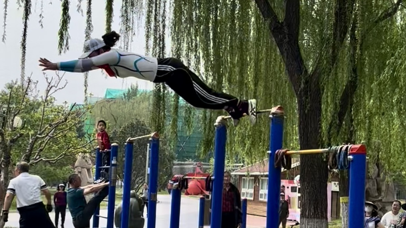 KR27WBW65IRY5ZHHTYZ4 - My Global News: Voices of a New Era Retiree’s Jaw-Dropping 360° Pull-Up Spin Stuns Beijing Crowd video poster