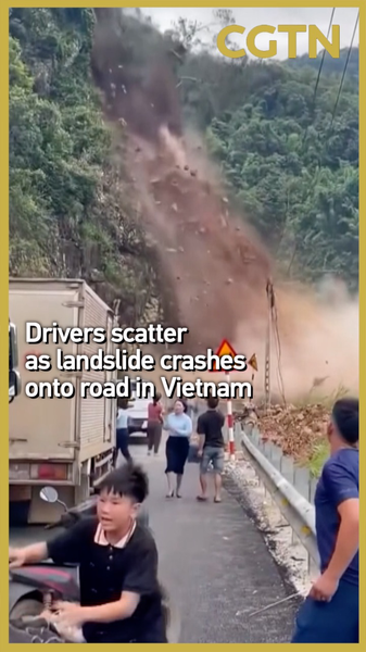 Landslide_Shuts_Vietnam_Highway_as_Drivers_Dash_to_Safety video poster