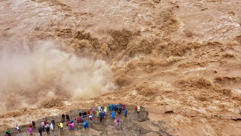 Yellow_River_s_Hukou_Waterfall_Turns_into_Thunderous_Golden_Cascade video poster
